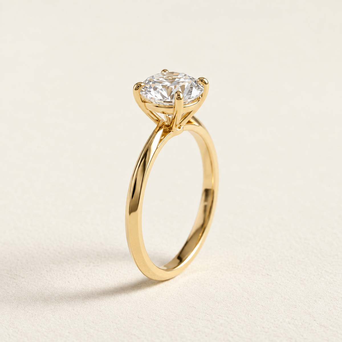AI-generated visualization — 1 ct Lab Diamond Solitaire Engagement Ring in yellow gold, warm ivory studio display