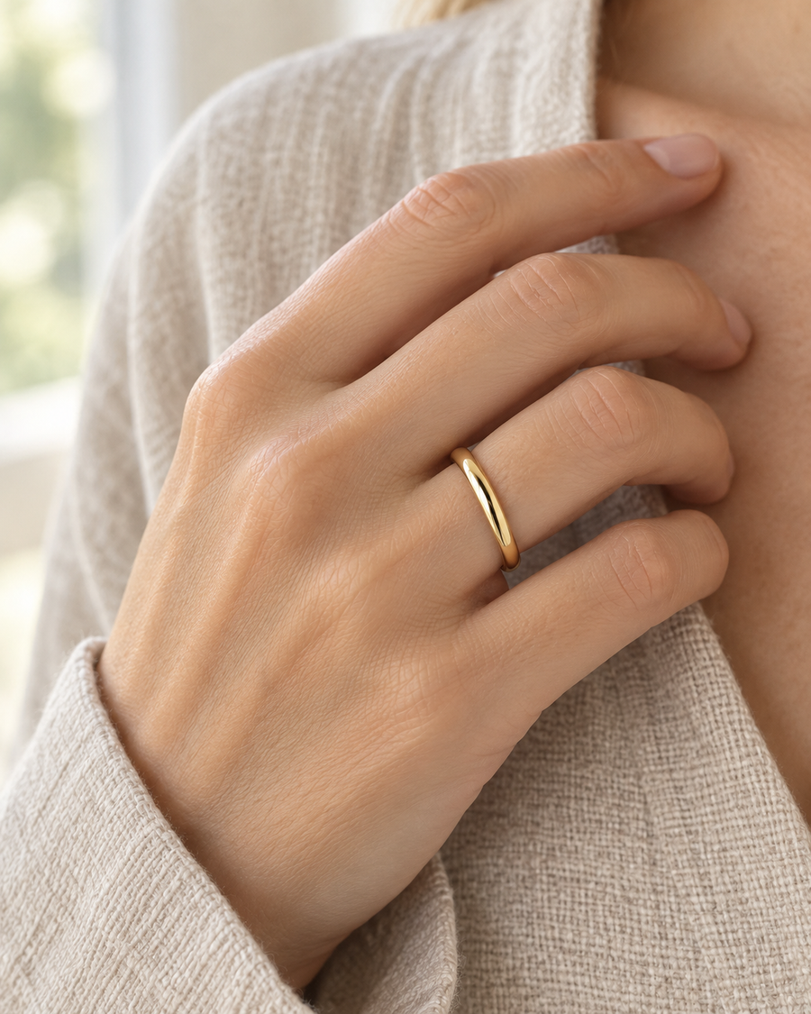 AI-generated visualization — Classic Comfort-Fit Band — 2.5 mm in yellow gold, comfort-fit band on an adult hand