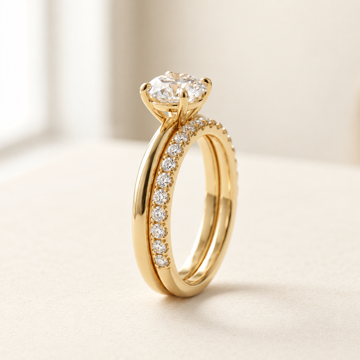 AI-generated visualization — Featherline Lab Diamond Bridal Stack in yellow gold, warm ivory studio display