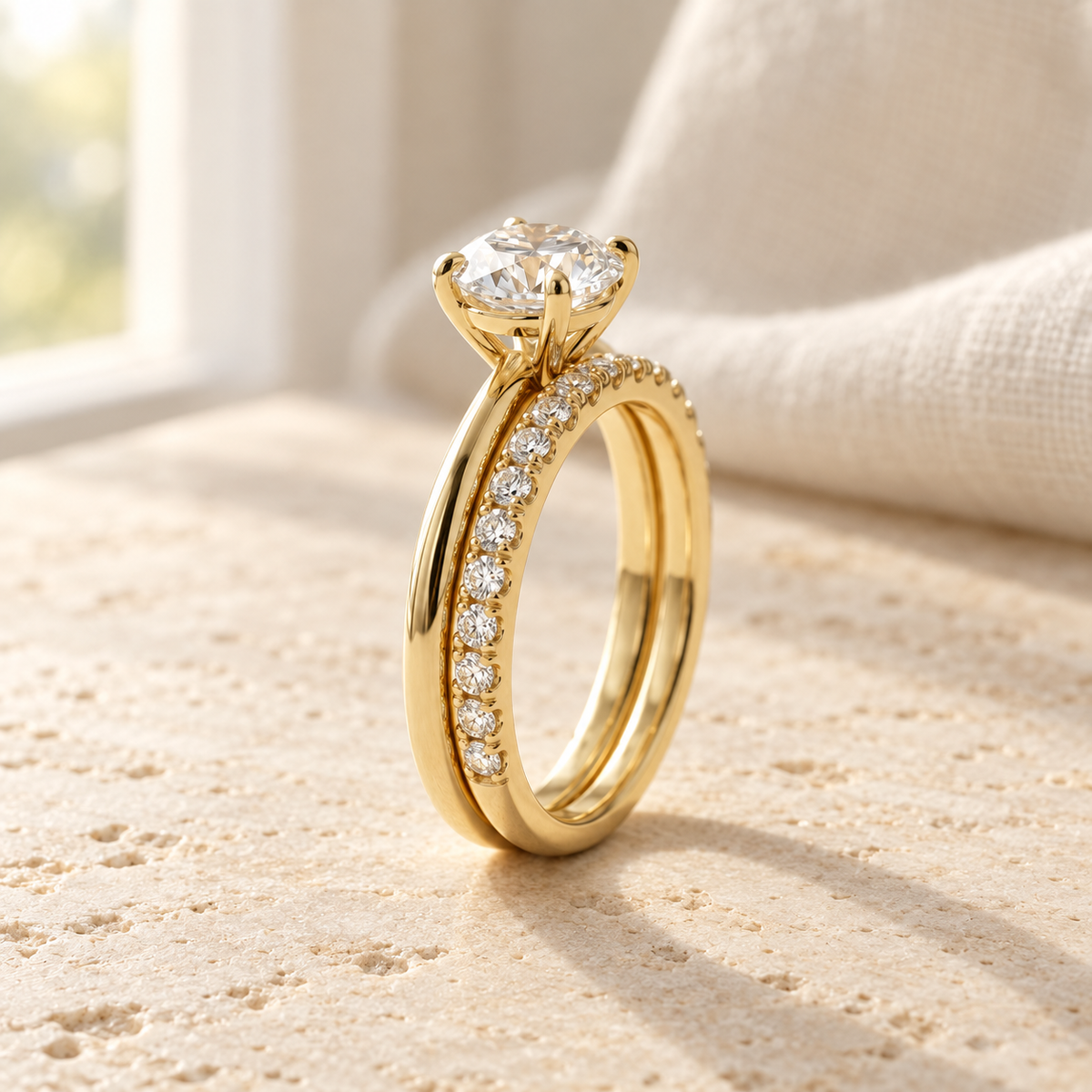 AI-generated visualization — Featherline Lab Diamond Bridal Stack in yellow gold, natural-window tabletop display