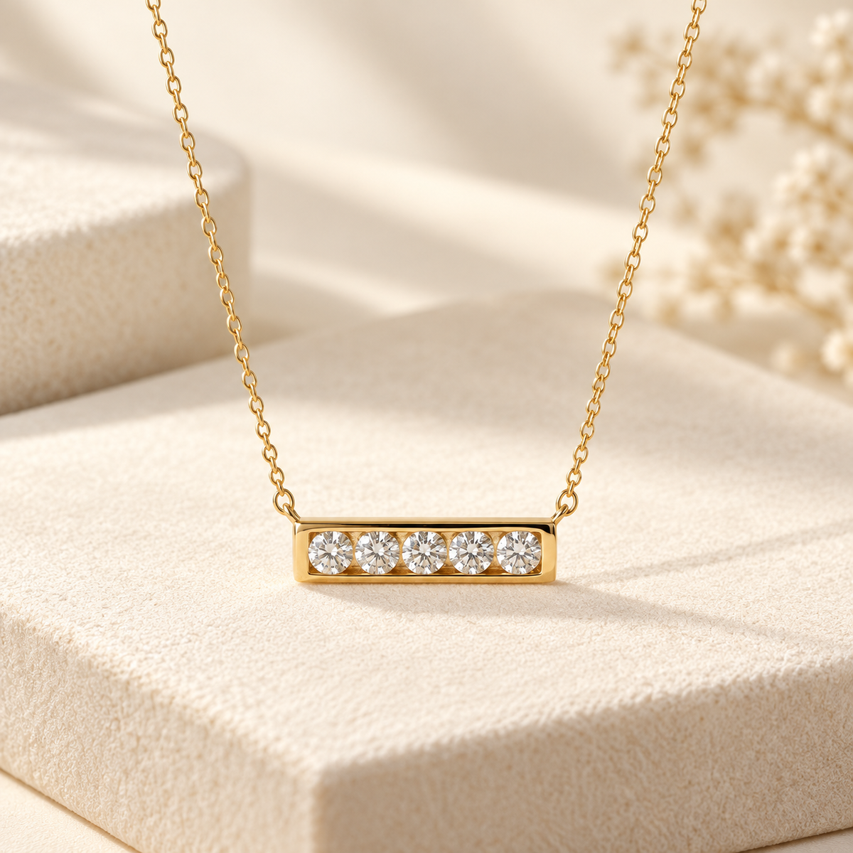 AI-generated visualization — Lab Diamond Five-Stone Bar Necklace in yellow gold on a warm ivory studio display.