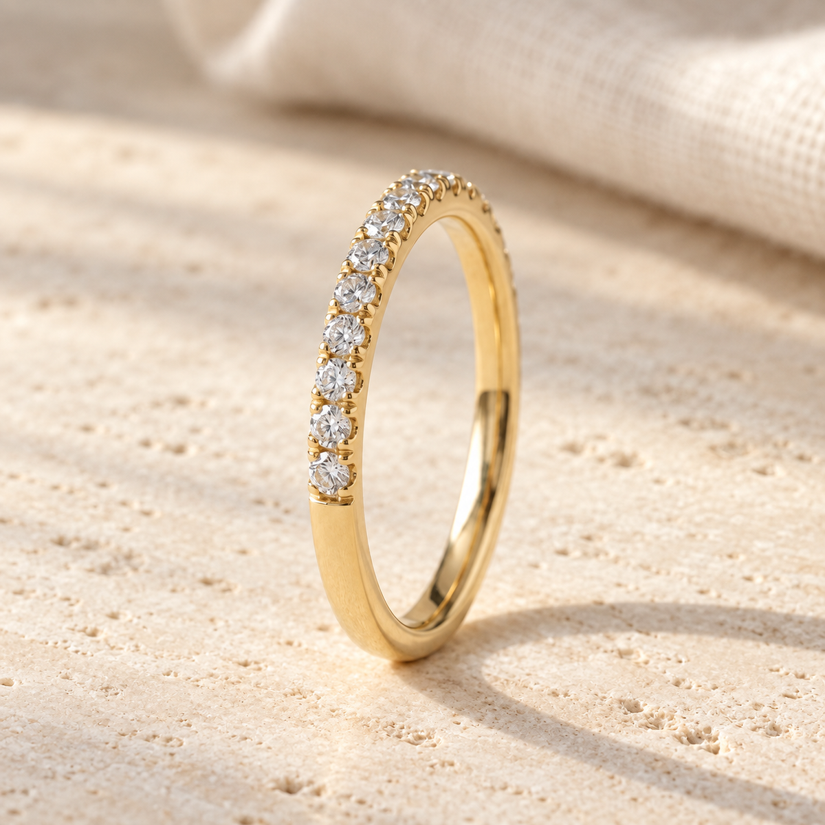 AI-generated visualization — Lab Diamond Half-Eternity Pavé Band in yellow gold, natural-window tabletop display