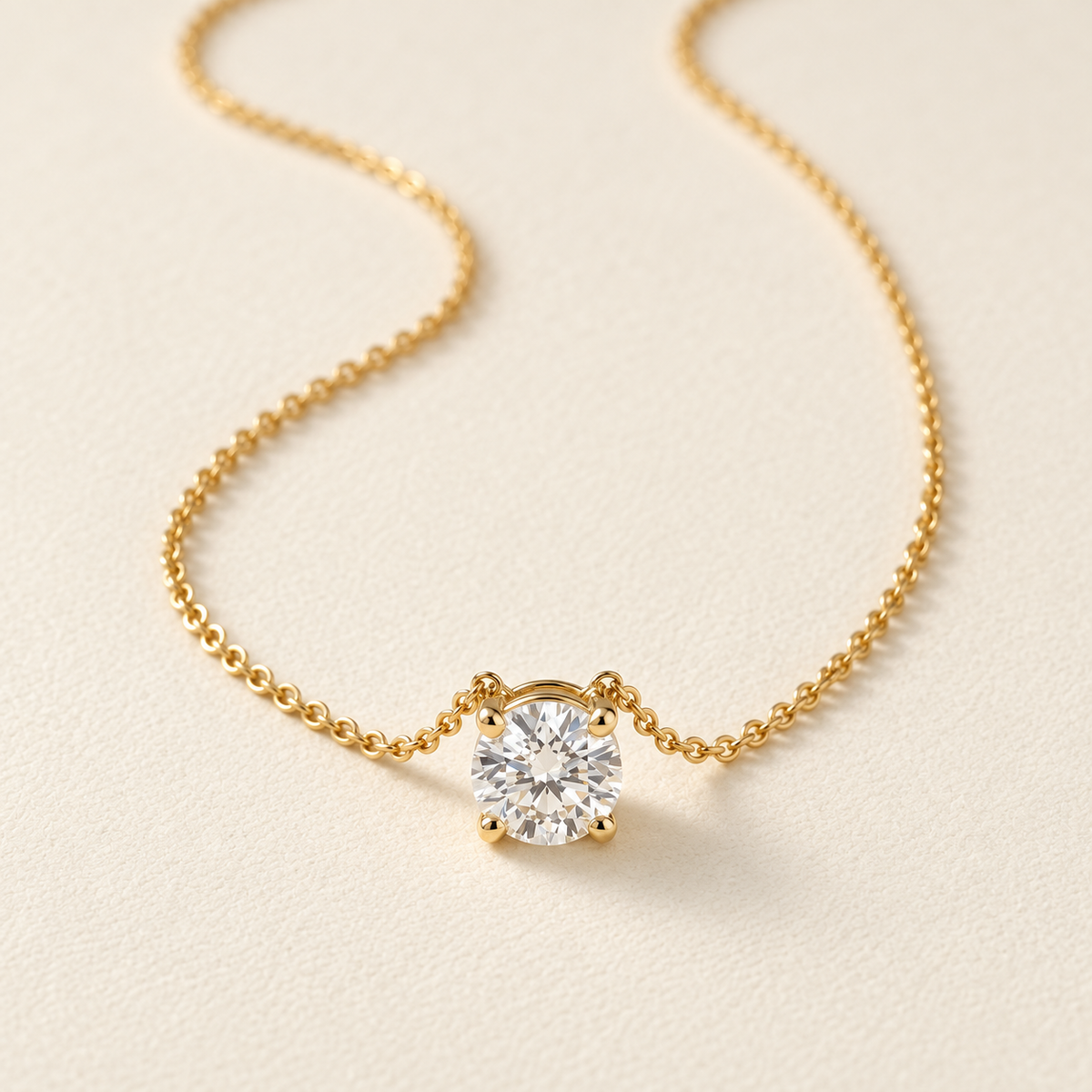 AI-generated visualization — Lab Diamond Solitaire Pendant Necklace in yellow gold on a warm ivory display.